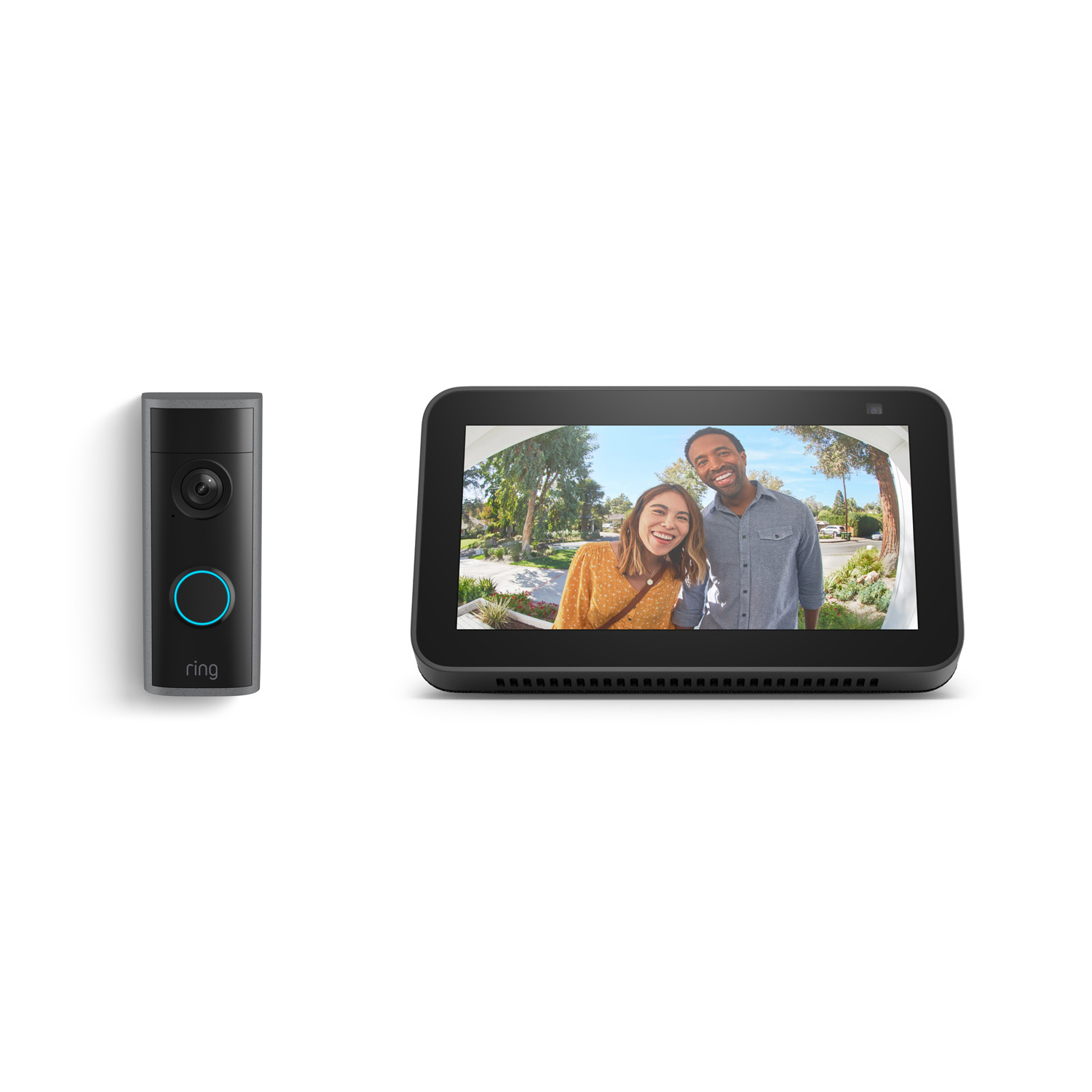 Peephole Cam 2K + Echo Show 5 - Ring video doorbell next to a smart display showing two smiling visitors at a front door on a sunny day.