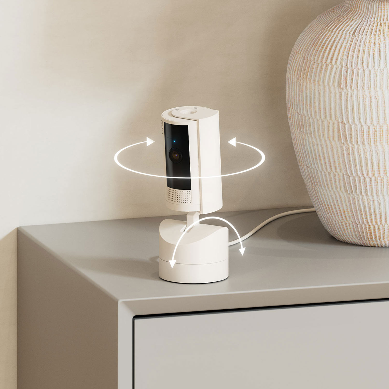 Inside Home Enhanced Kit (Pan-Tilt Indoor Cam + Alarm Security Kit, 5-Piece + Alarm Flood & Freeze Sensor + Alarm Smoke and CO Listener) - Pan-Tilt Indoor Cam on a surface dresser.