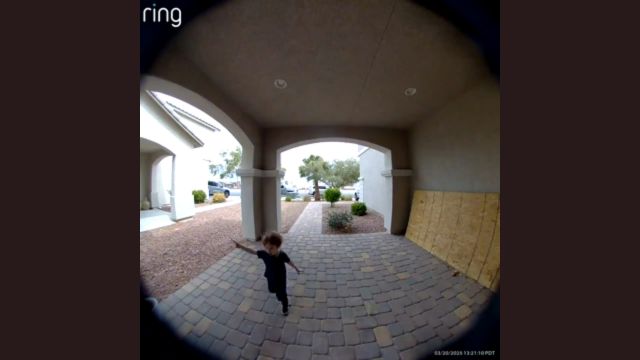 A young child humorously yells while running towards the door.