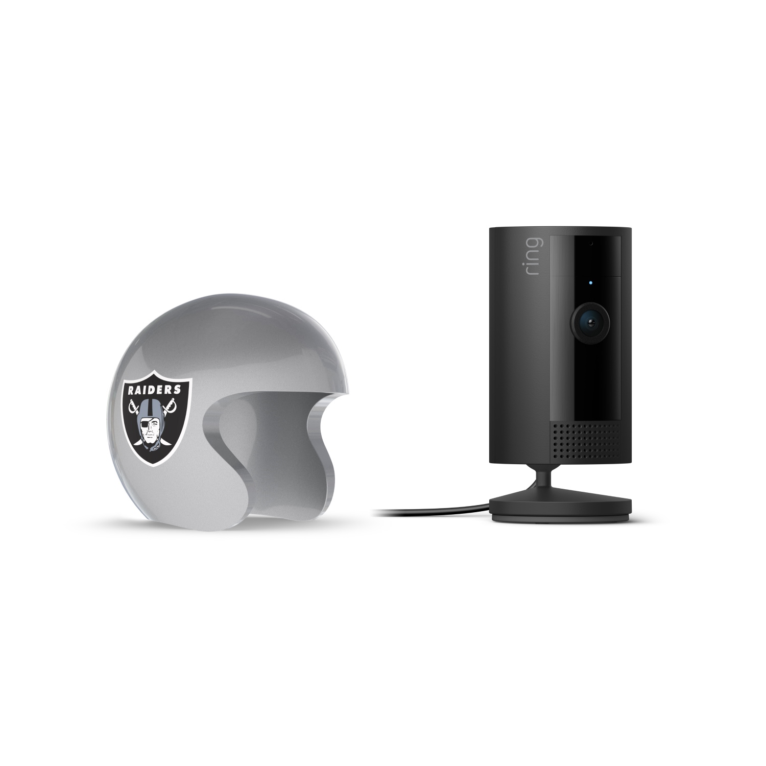Indoor Cam, Black + NFL Game Day Cam Cover — AFC - Black Ring indoor camera on a stand next to a silver football helmet with the Raiders logo, on a white background.