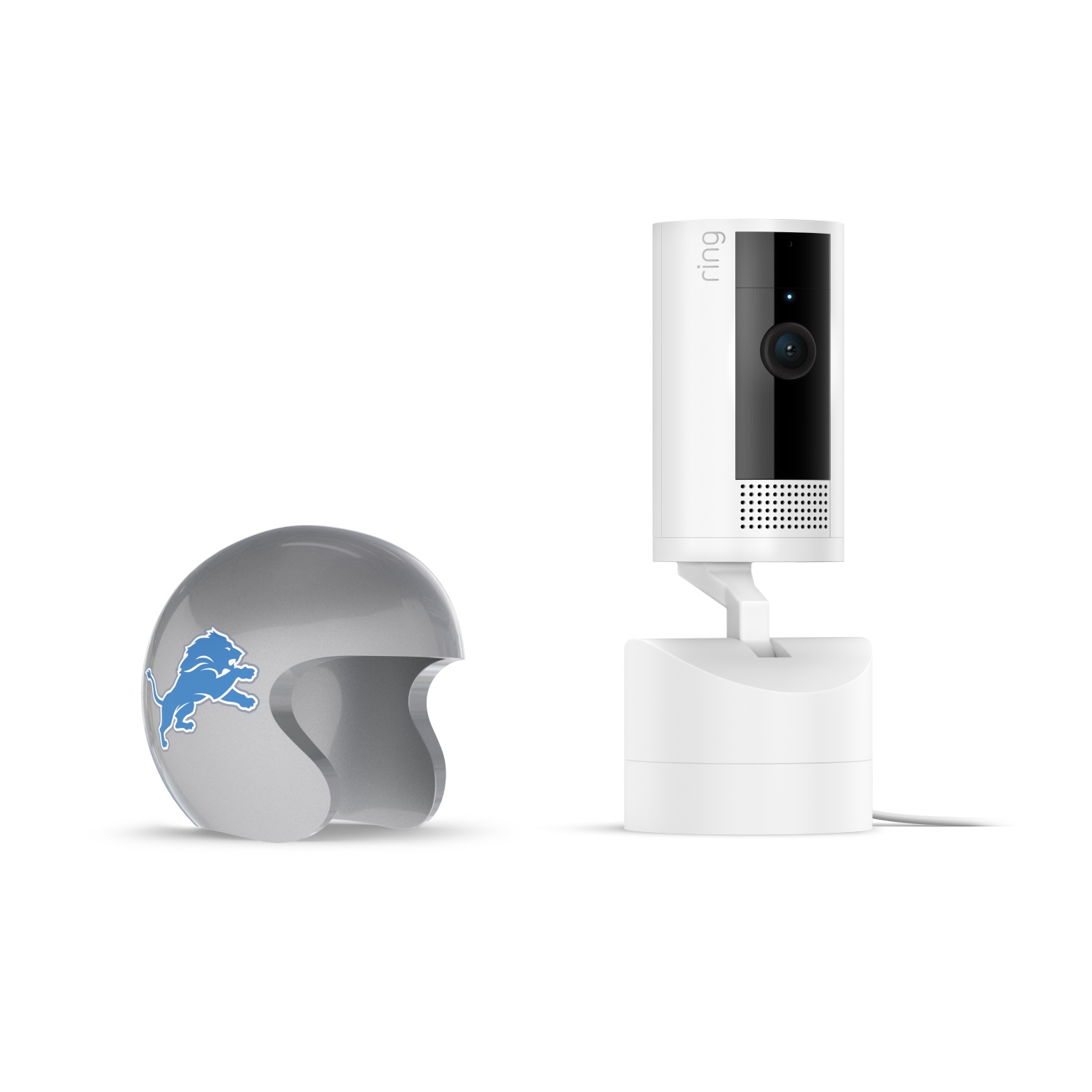 Pan-Tilt Indoor Cam, White + NFL Game Day Cam Cover — NFC - White Ring indoor camera on stand with power cable, next to a gray mini football helmet featuring a blue lion logo on a white background.