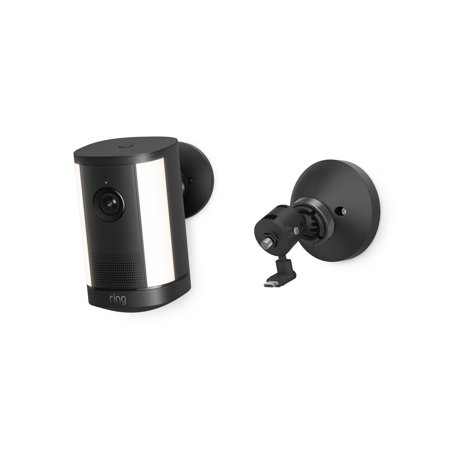 Spotlight Cam 4K Plus - Black wall-mounted smart camera with dual light panels and lens centered on front, shown beside an adjustable mounting bracket.