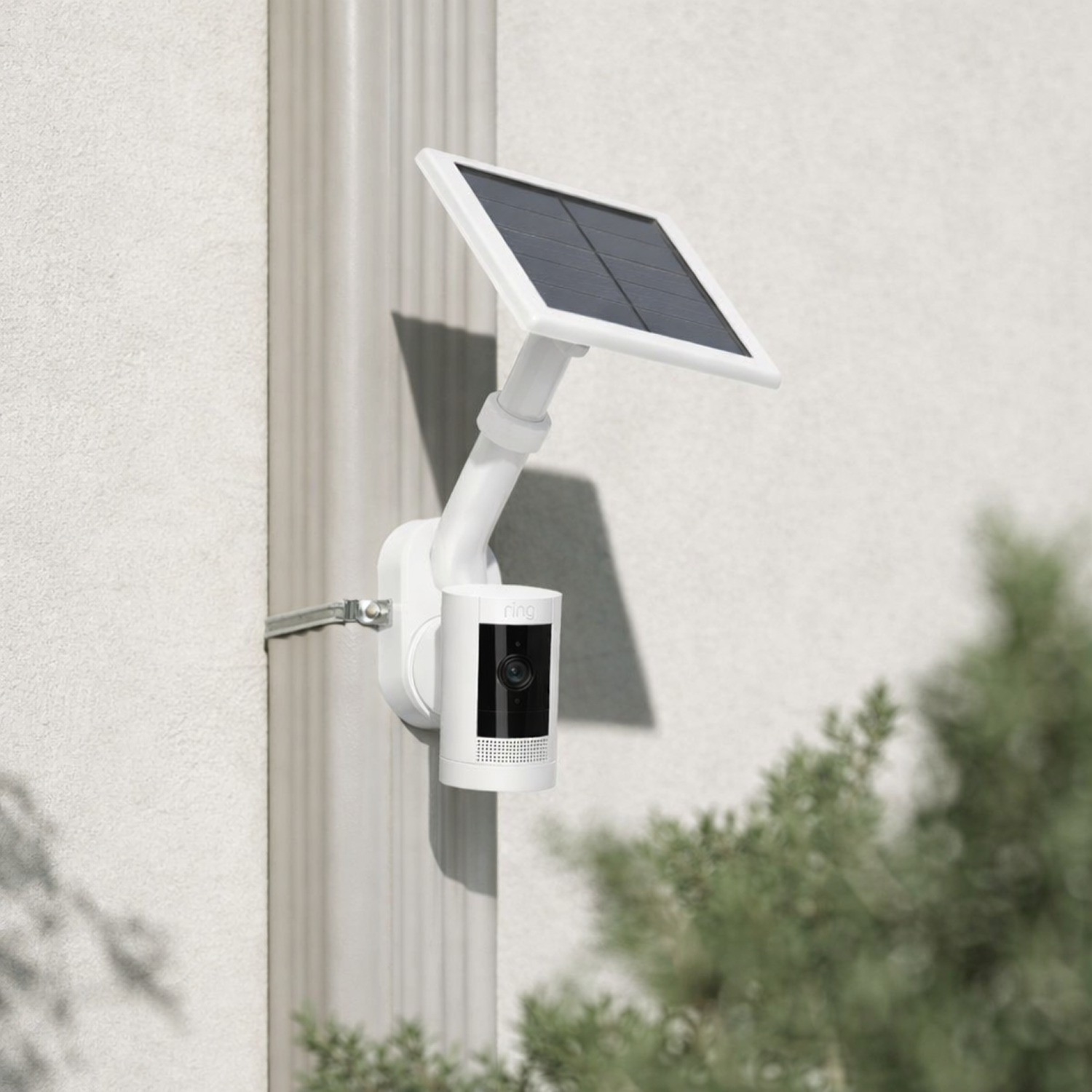 Outdoor Camera Solar Kit - White  Outdoor Camera Solar + Pole and Wall Mount mounted to white wall