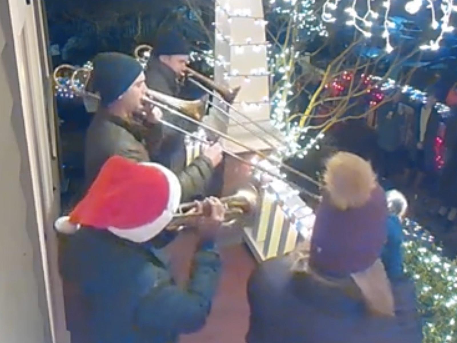 Group of musicians performing on the front porch.