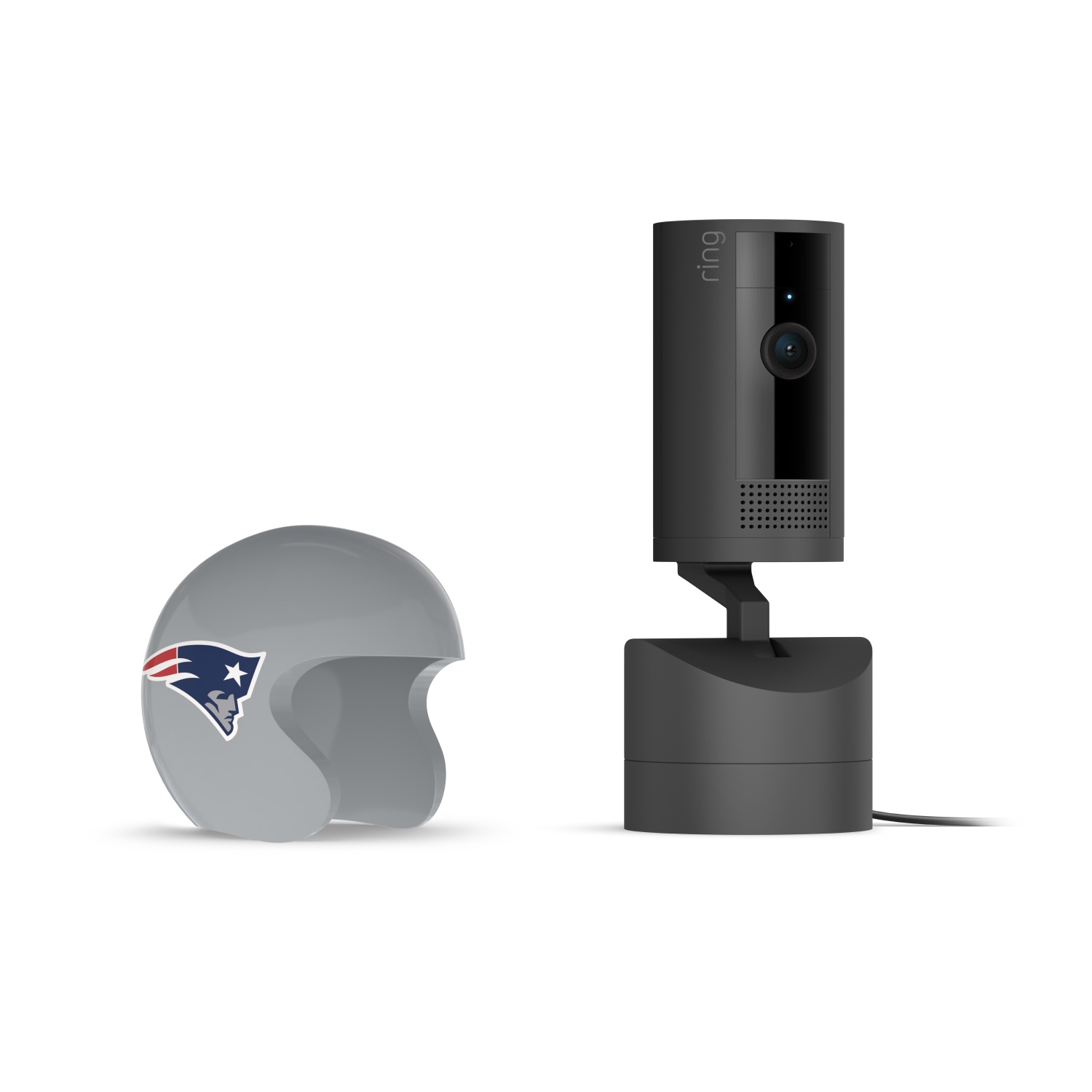 Pan-Tilt Indoor Cam, Black + NFL Game Day Cam Cover — AFC - Black Ring indoor camera on a base next to a gray mini football helmet with the New England Patriots logo on a white background.
