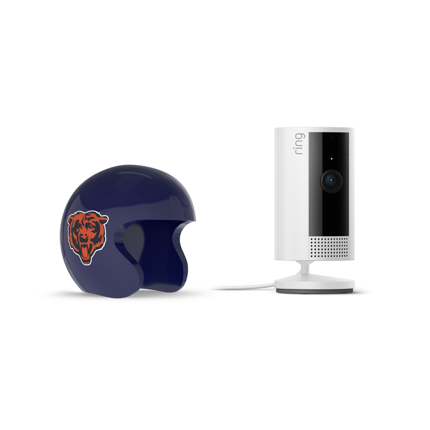 Indoor Cam, White + NFL Game Day Cam Cover — NFC - White Ring indoor camera on a stand beside a navy mini football helmet with an orange bear logo on a plain white background.