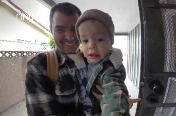 Father baby at door