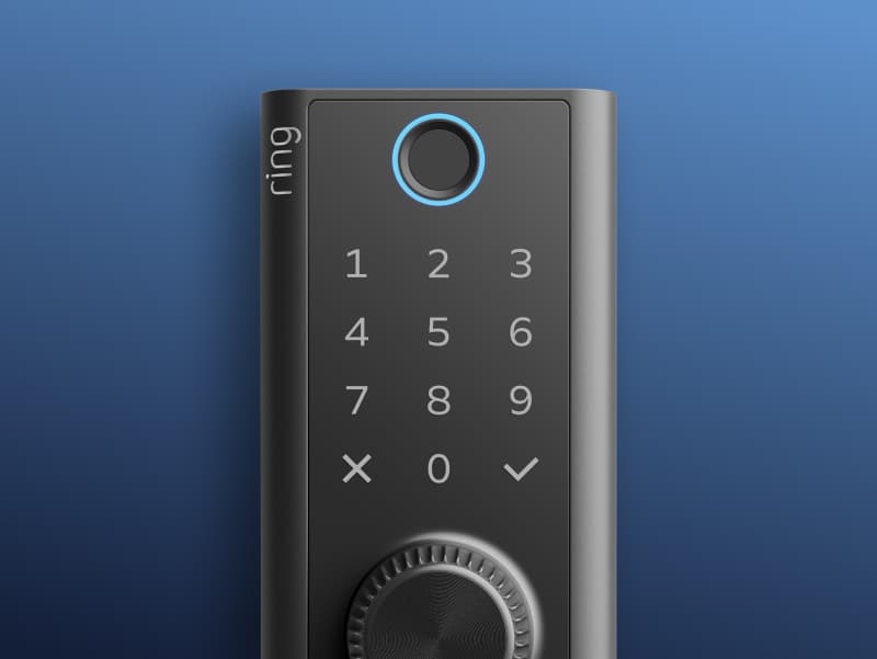 Close-up of a sleek black smart door keypad with illuminated blue ring knob, numbered touchpad, and checkmark button on a blue background.