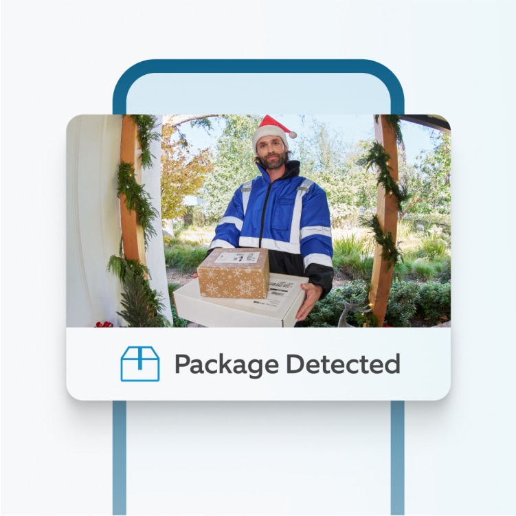 Delivery driver holding packages at front door, with alert reading, 'Package Detected.'