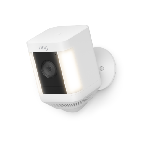 White Ring Spotlight Cam Plus Battery with HD video, motion-activated lights, and color night vision, mounted on a wall.