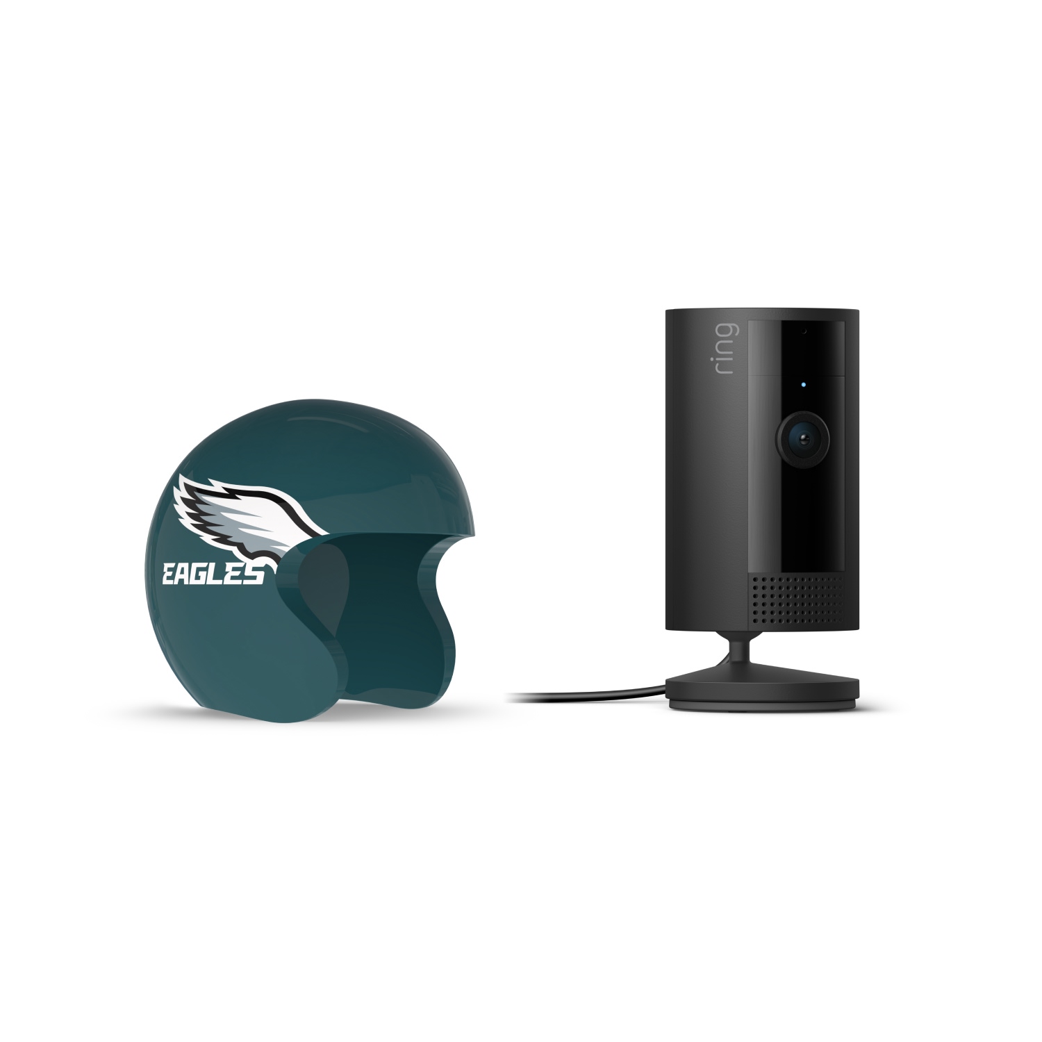 Indoor Cam, Black + NFL Game Day Cam Cover — NFC - Black Ring indoor camera on a stand next to a teal mini helmet with a white wing logo and “Eagles” text on a white background.