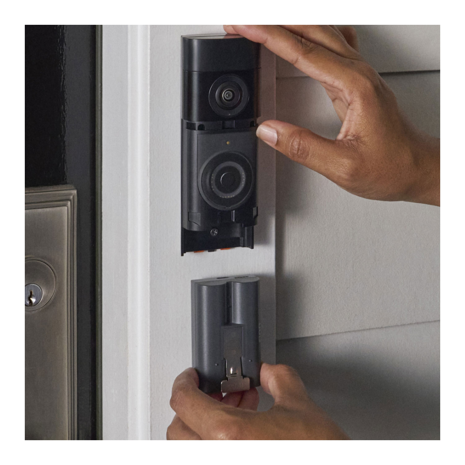 Battery Doorbell Plus (Newest Model) - Battery Doorbell Plus (2nd Gen) against a white doorframe surface showing easily removal of battery pack.