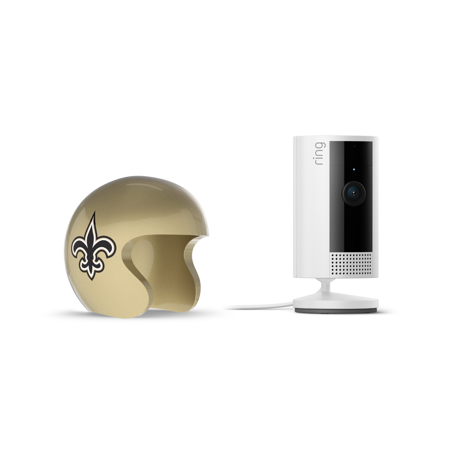 Indoor Cam, White + NFL Game Day Cam Cover — NFC - Gold football helmet with a black fleur-de-lis next to a white Ring indoor camera on a stand with power cable, set against a white background.