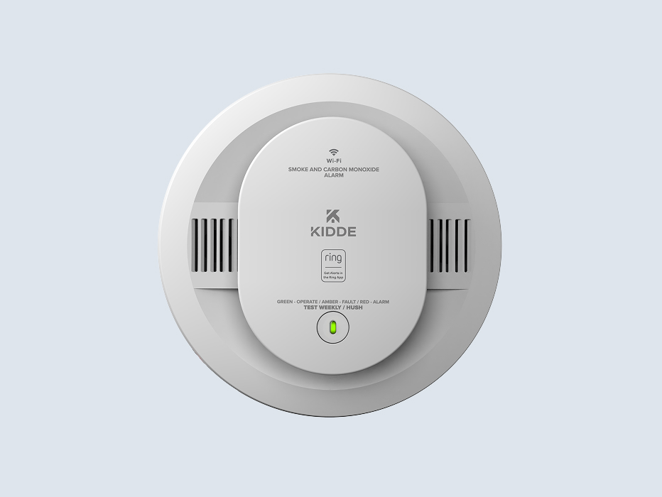 White Kidde Wi-Fi smoke and carbon monoxide alarm with Ring integration, showing green operational light indicator.