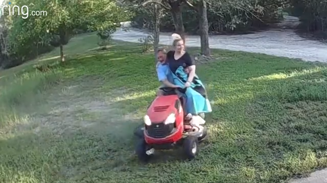 riding together on the lawn mower