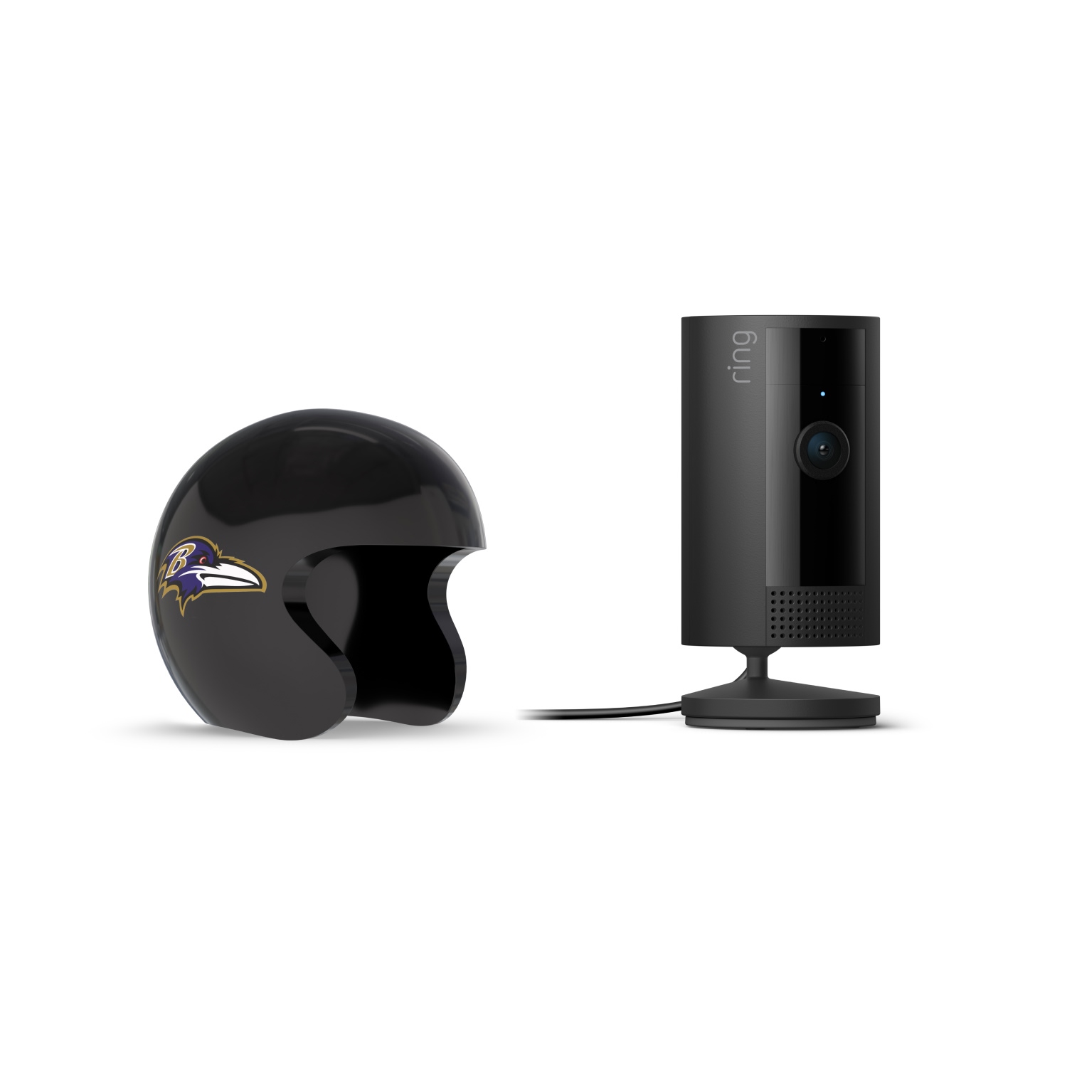 Indoor Cam, Black + NFL Game Day Cam Cover — AFC - Black Ring indoor camera on a stand beside a glossy black football helmet with a purple-and-gold raven logo, set against a white background.