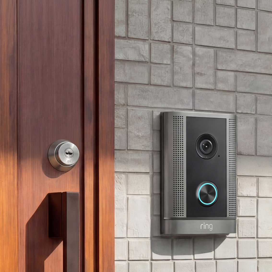 Silver Smart Intercom mounted to tile wall next to wooden door