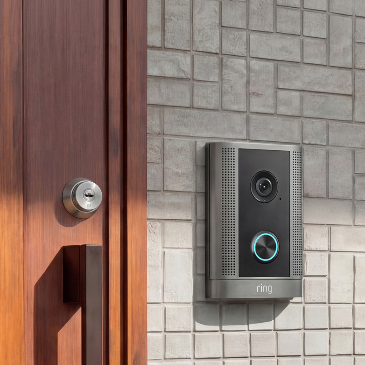 Silver Smart Intercom mounted to tile wall next to wooden door