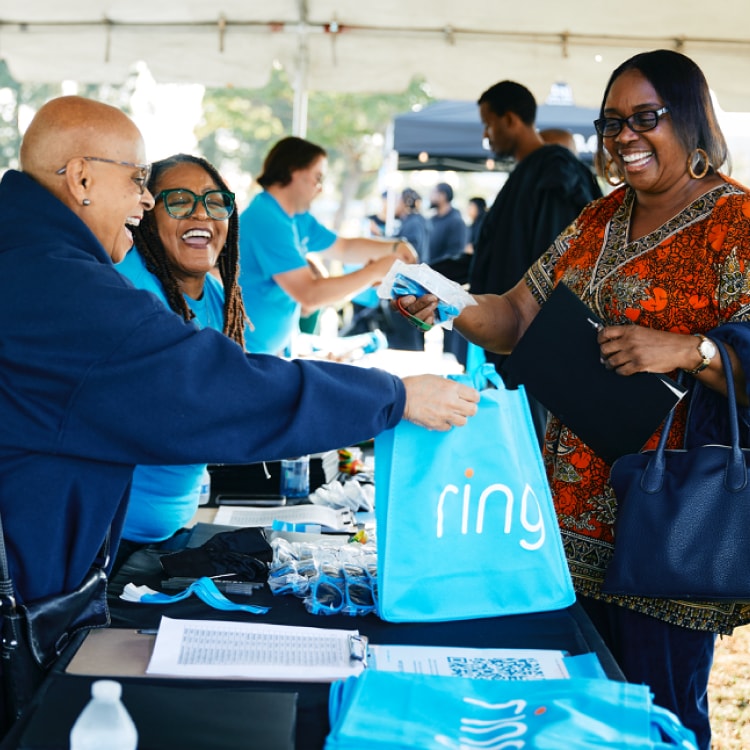 Collage of community events supported by Ring, including a man holding a Ring device at his doorstep, a group receiving a donation check, and people engaging a a Ring-sponsored event.