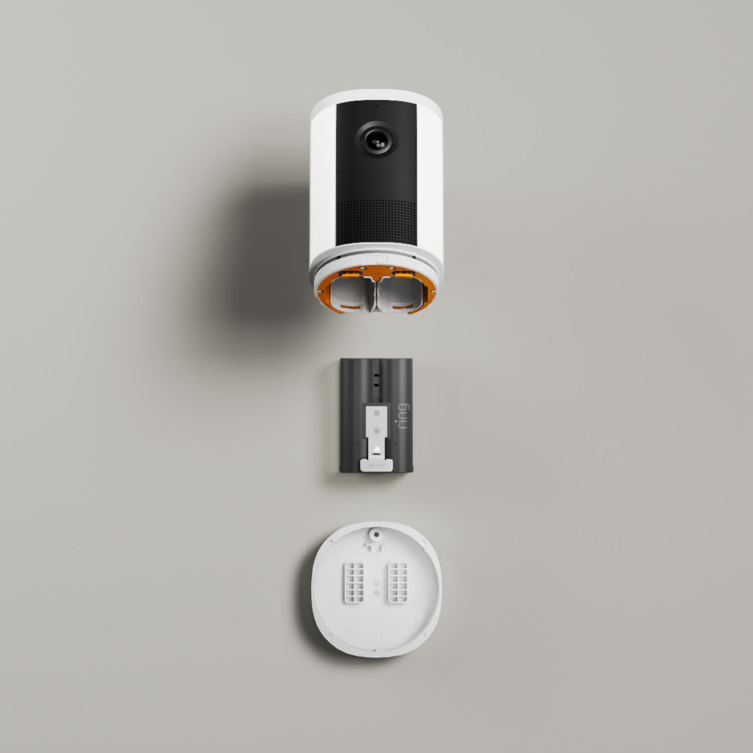 Spotlight Cam (Newest Model) - Battery:Spotlight Cam (2nd Gen) battery pack, and round mounting plate aligned on a gray background.