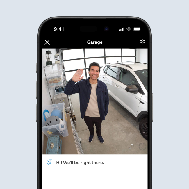 Smartphone showing live video of a burglar grabbing a package.
