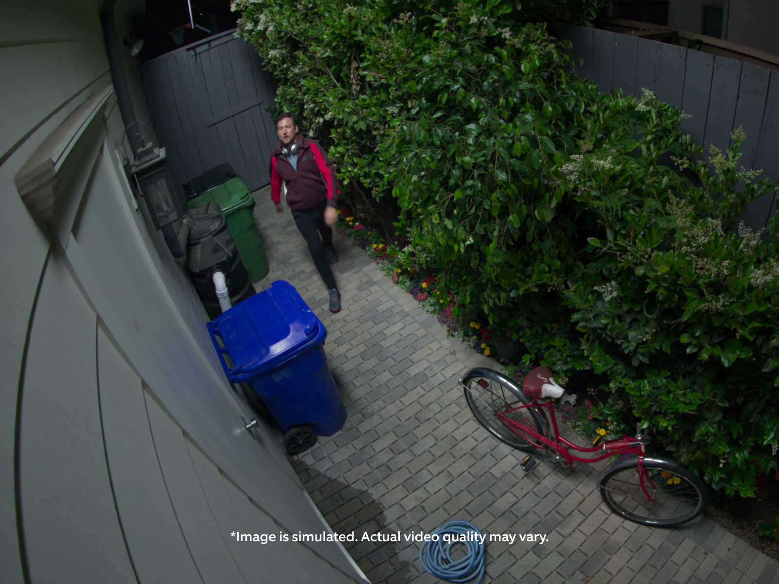 Video of a man walking into a sideyard. A vertical white line slides across the screen, revealing vibrant colors and lighting. Disclaimer reads: 