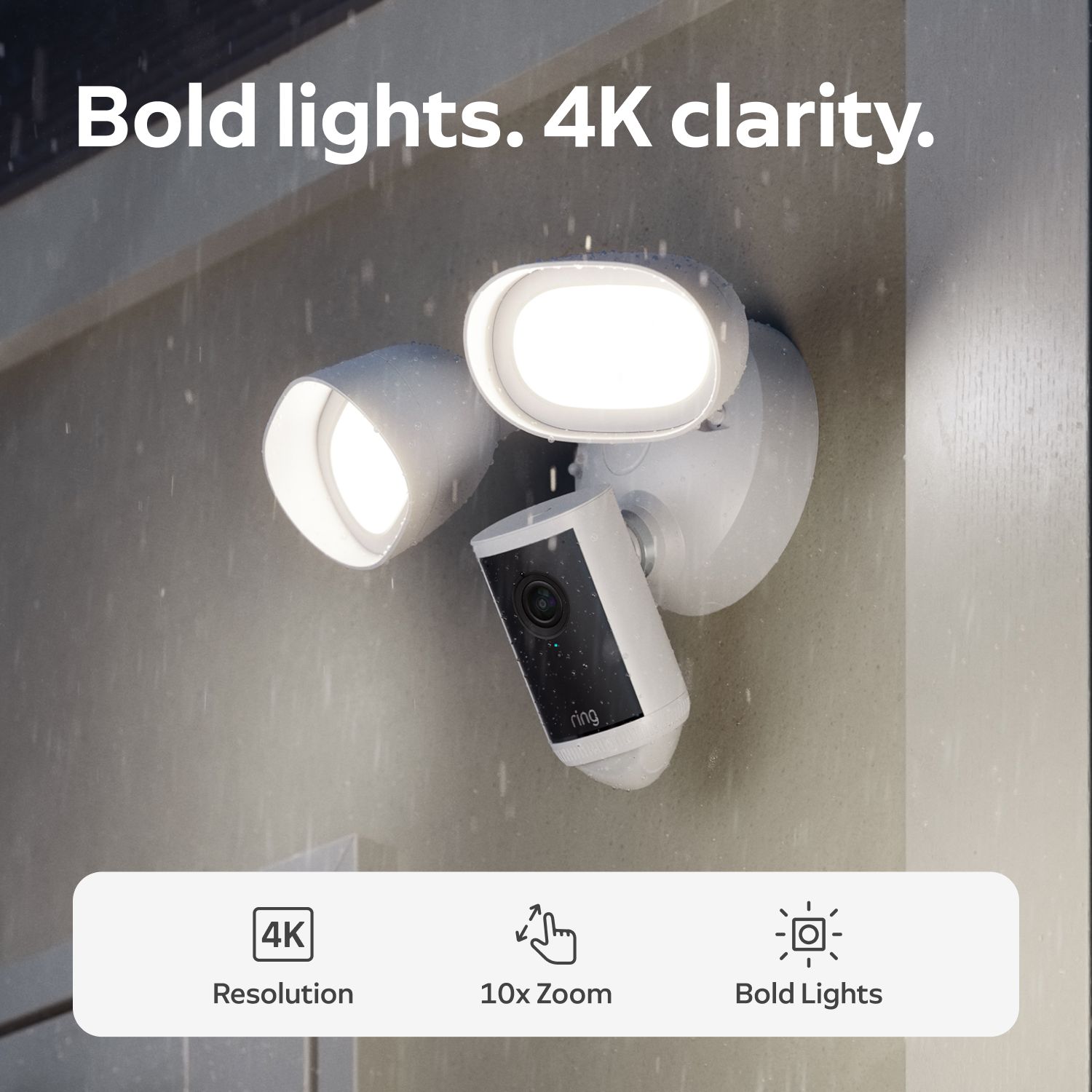 Floodlight Cam 4K Pro - Outdoor Ring Floodlight camera on a wall in rain, two bright LED lamps and lens visible, text highlights 4K resolution and 10x zoom.