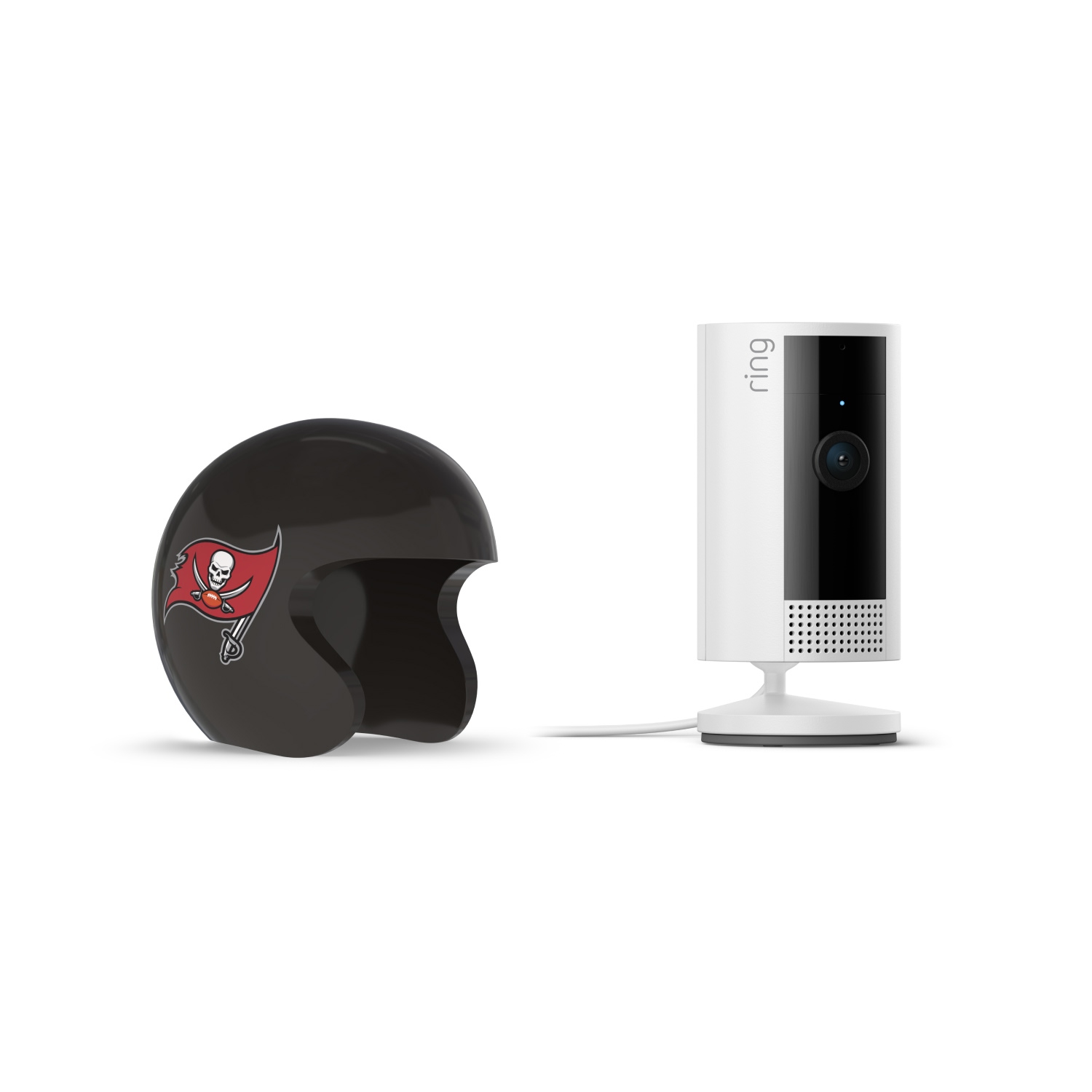 Indoor Cam, White + NFL Game Day Cam Cover — NFC - Black mini football helmet with red pirate flag logo next to a white Ring indoor security camera on a stand with power cord.