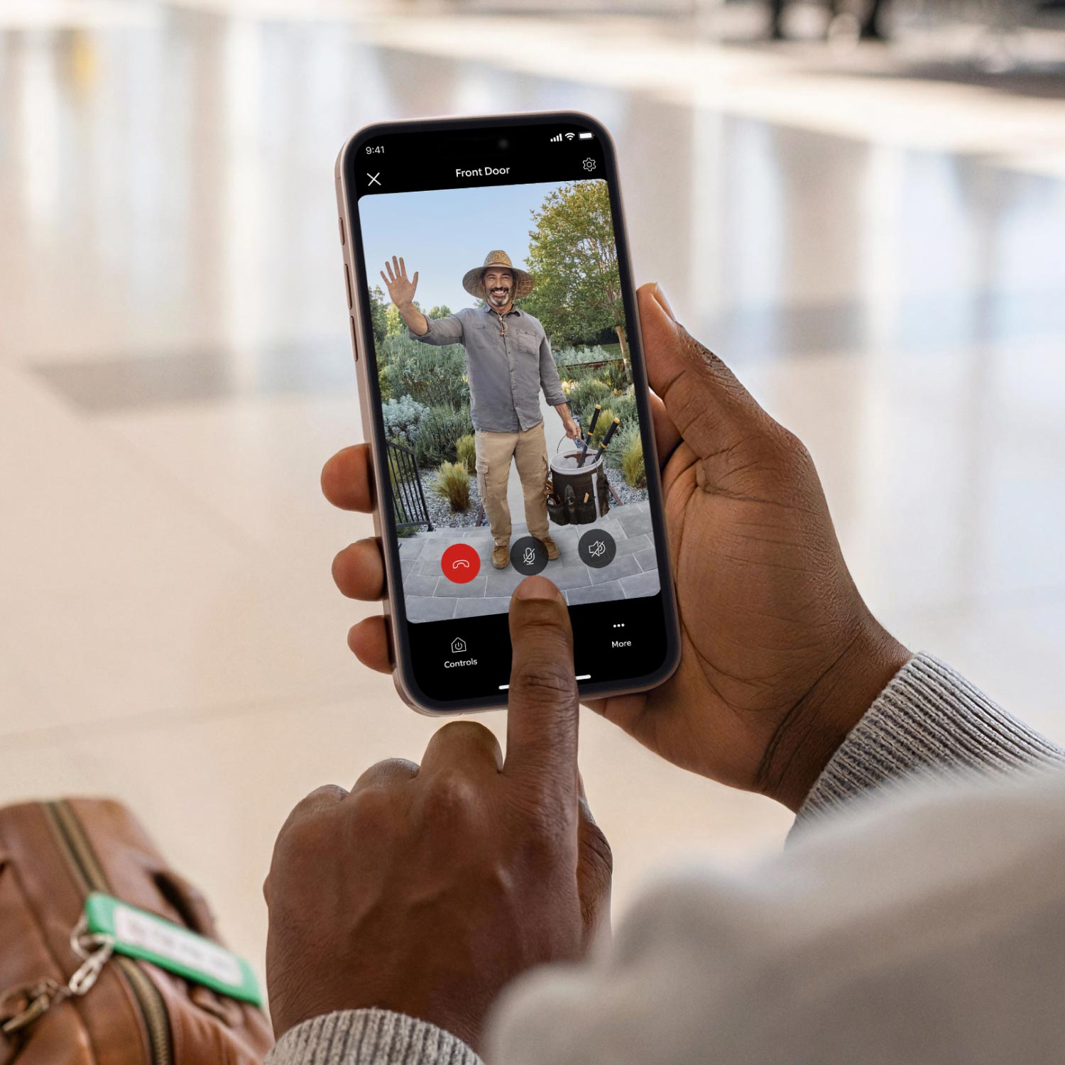 Battery Doorbell (Newest Model) - Image of smart phone device showing live footage of guest at the front door.