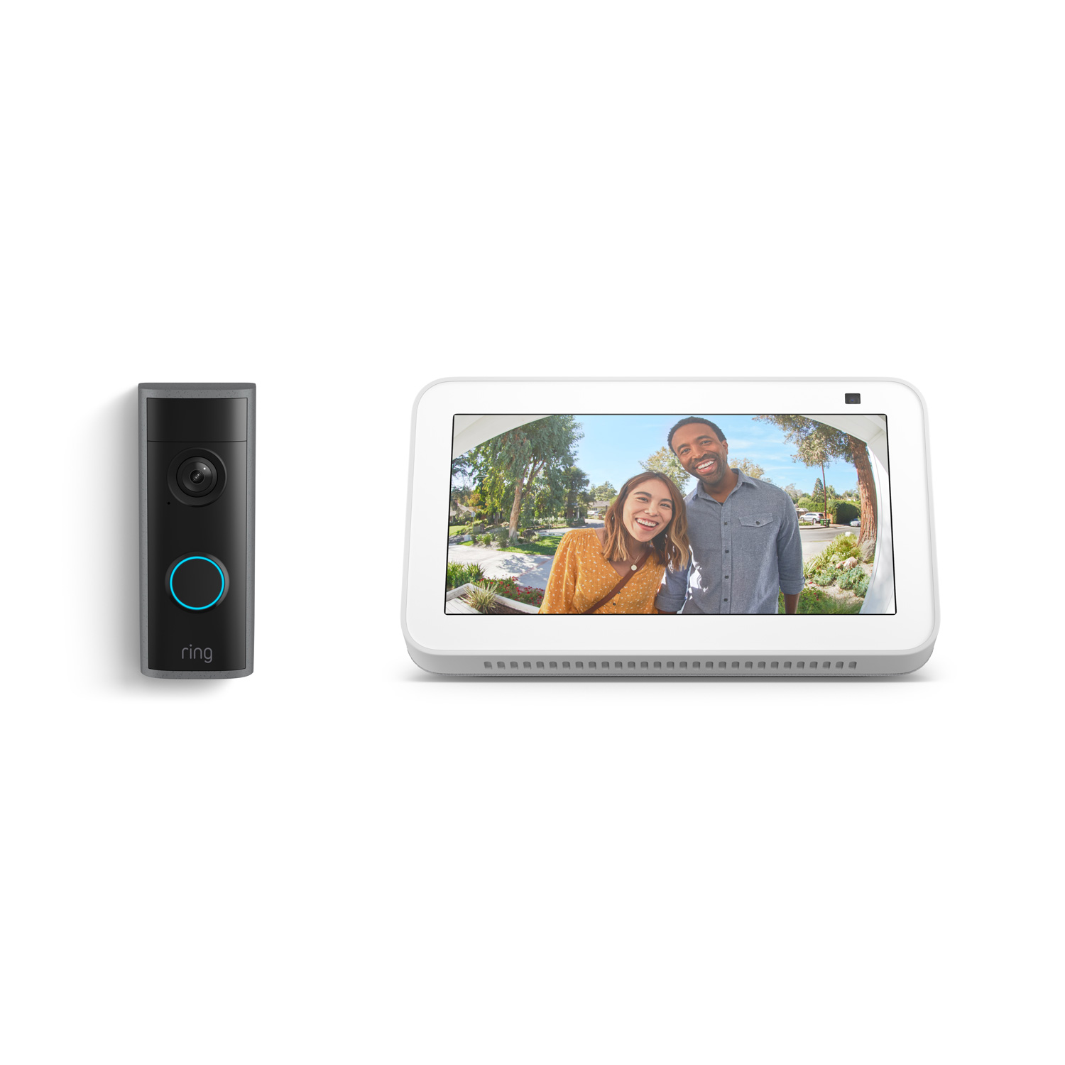 Peephole Cam 2K + Echo Show 5 - Black Ring doorbell next to a white smart display showing a wide-angle view of two smiling visitors at a front door.