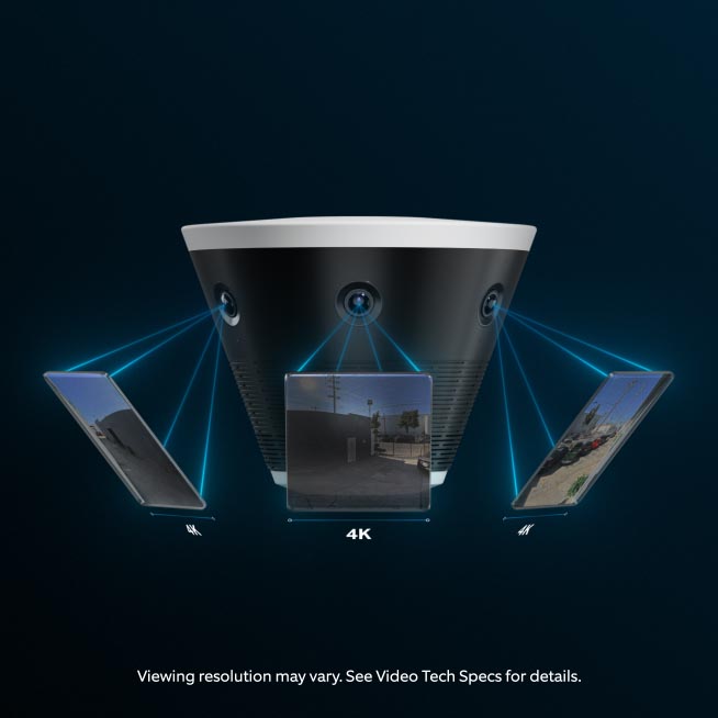 Black multi-lens security camera projecting three 4K video feeds of outdoor scenes against a dark blue background.