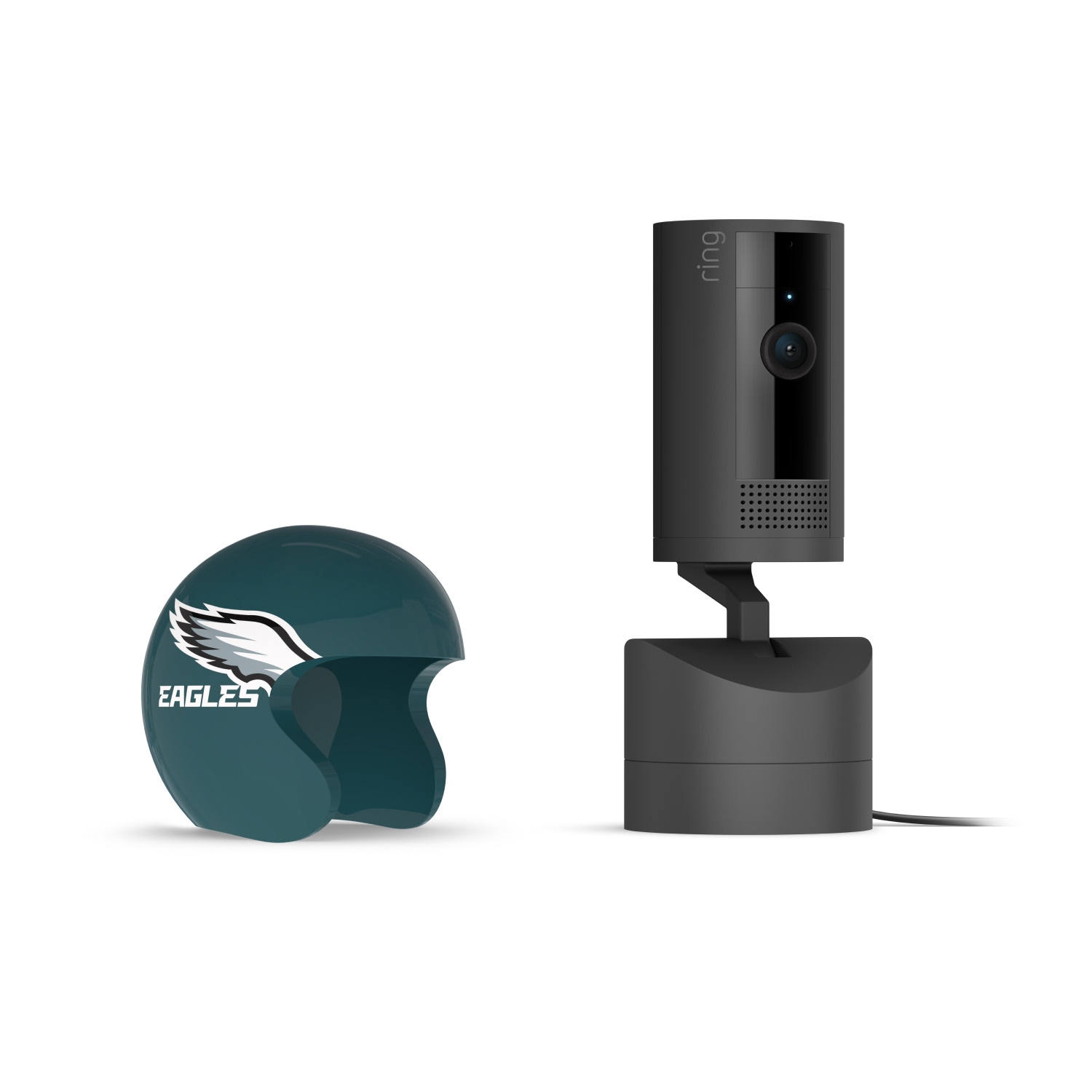 Pan-Tilt Indoor Cam, Black + NFL Game Day Cam Cover — NFC - Black Ring indoor camera on a stand next to a dark green Eagles mini helmet cover with white wing logo on a white background.