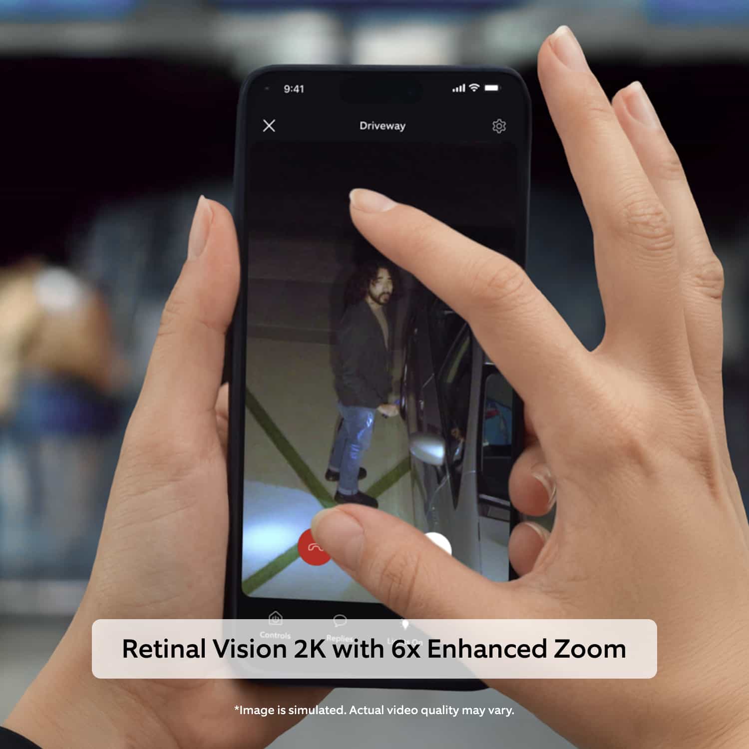 Floodlight Cam - Hands pinch-zoom on a smartphone showing a night driveway video of a person near a parked car; text reads “Retinal Vision 2K with 6x Enhanced Zoom.”
