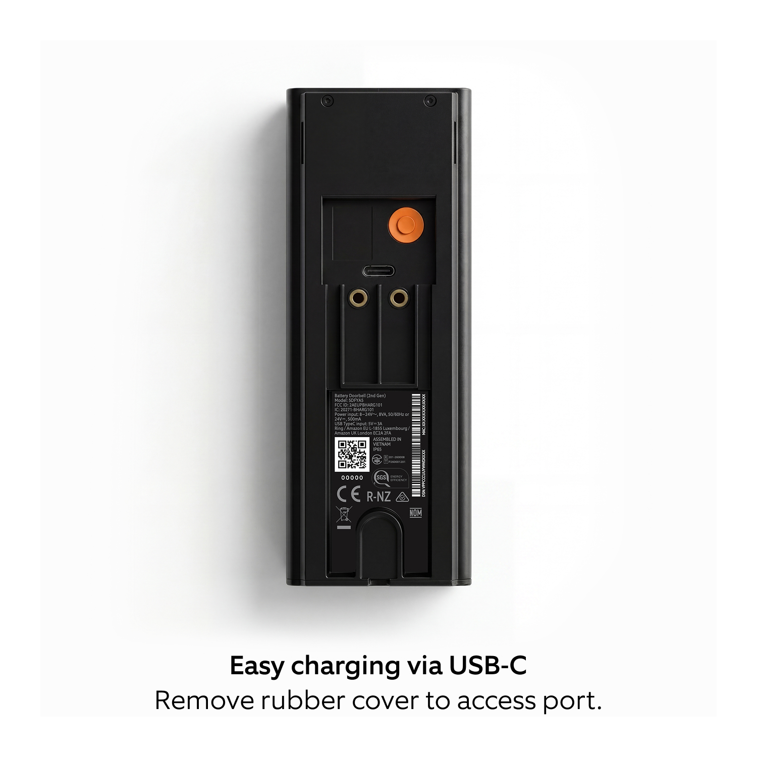 Battery Doorbell 2K (Newest Model)  - Back of a black device showing a USB‑C charging port under a removable rubber cover, with labels, QR code, and gold contacts.