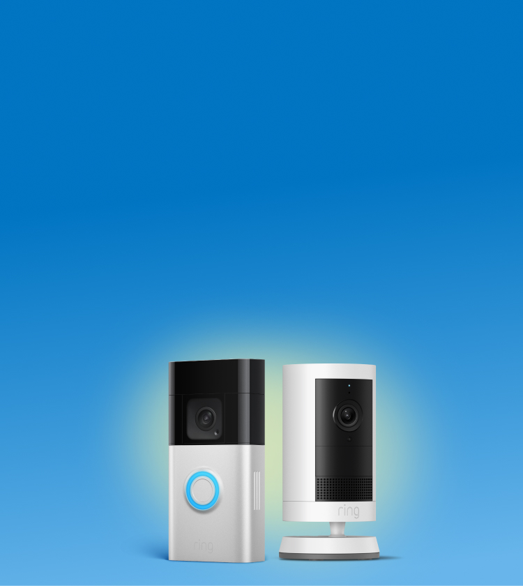 Two Ring devices on a blue gradient: a silver video doorbell with a glowing blue button and a white indoor camera on a stand.