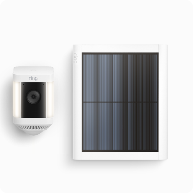 White Ring security camera with solar panel mounted on top, featuring illuminated LED light ring around the lens.