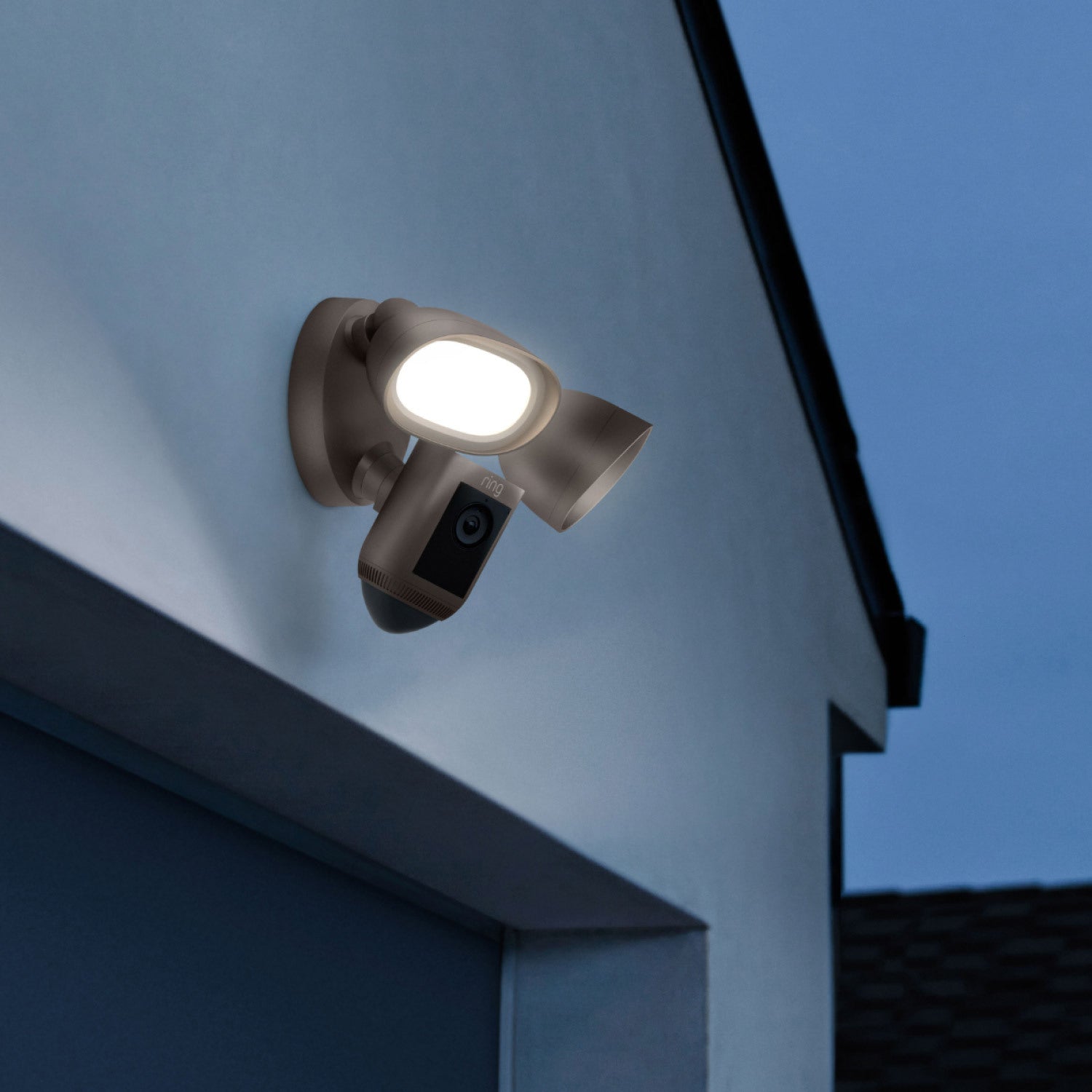 Floodlight Cam Wired Pro (Premium Colors) - Floodlight Cam Wired Pro with dark bronze finish mounted above a garage door.
