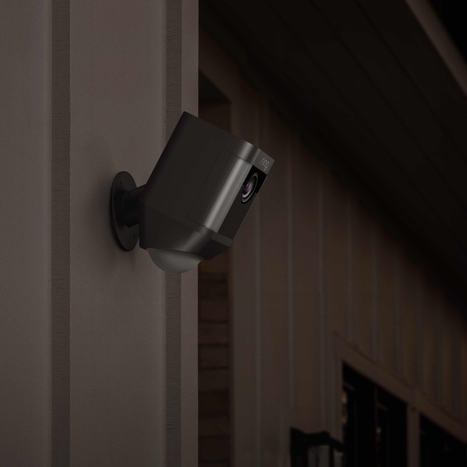 Spotlight Cam Battery (for Certified Refurbished) - Outdoors at night, Spotlight Cam Battery is mounted to an exterior wall.