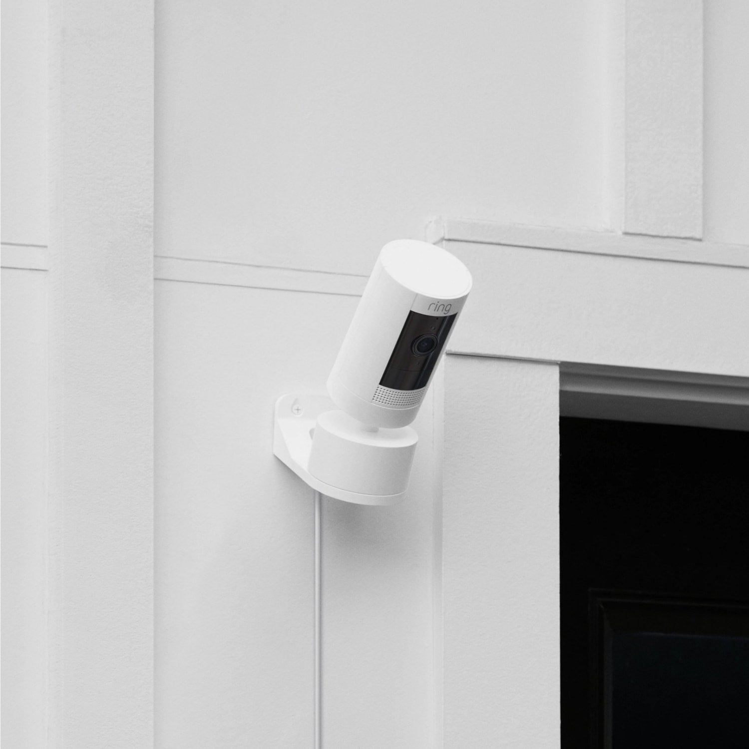 Stick Up Cam Plug-In with Pan-Tilt - Stick Up Cam Plug-In with Pan-Tilt in white mounted on exterior wall next to garage door.