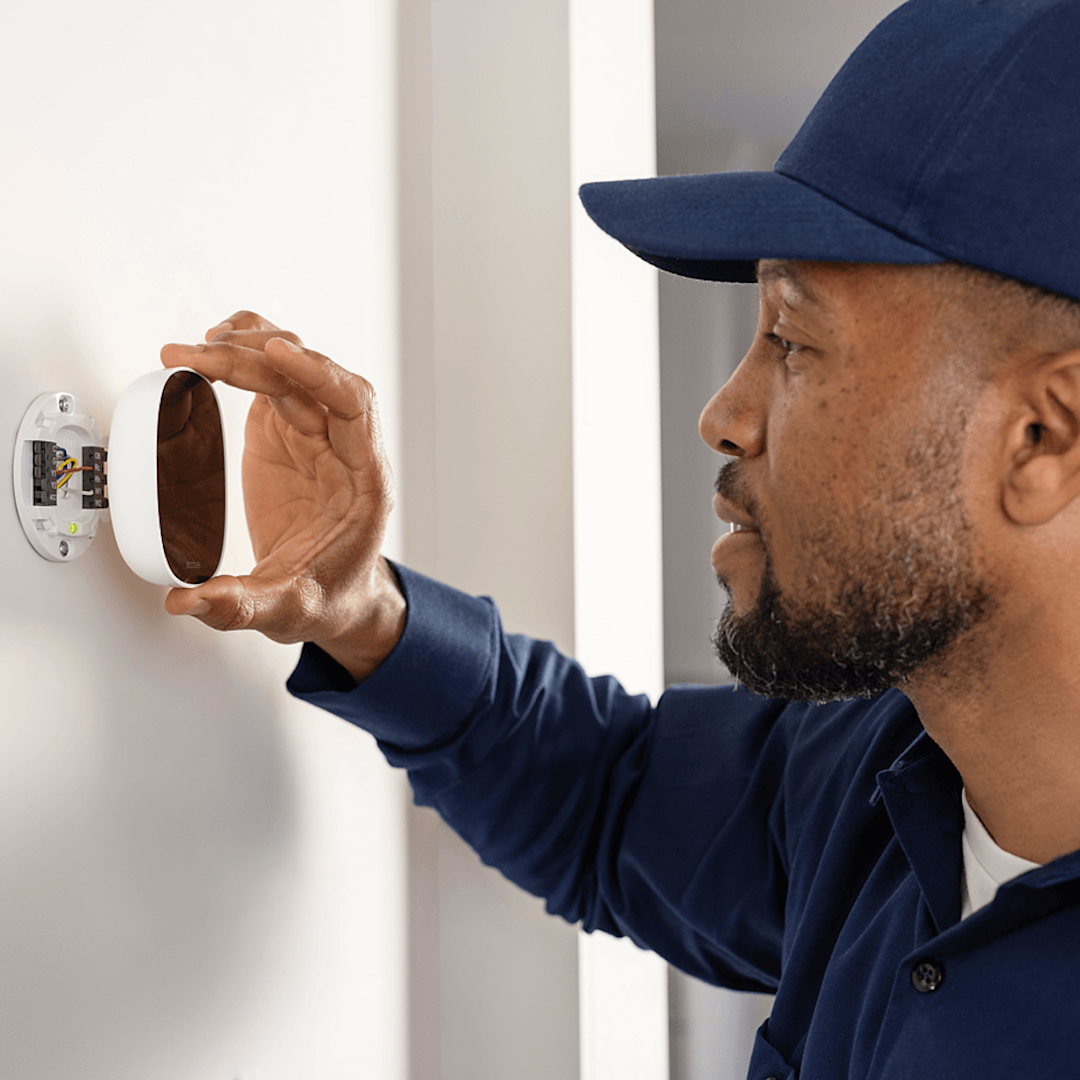 HVAC technician installs ecobee thermostat