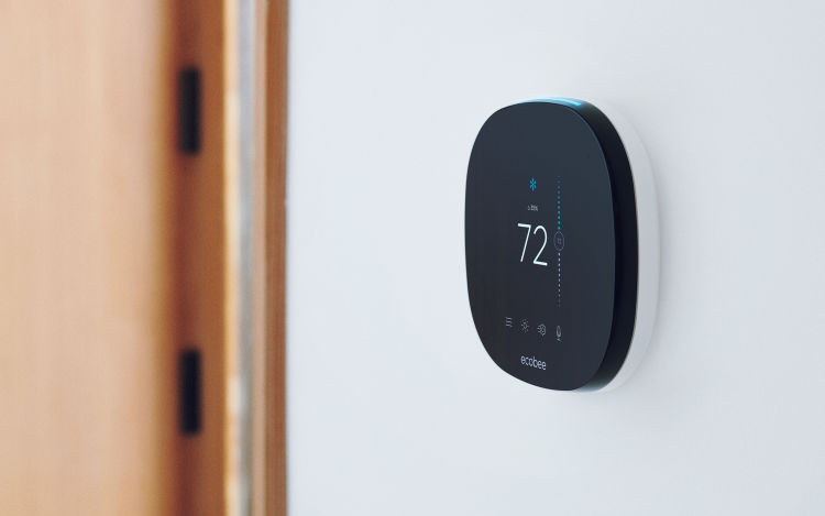 ecobee SmartThermostat with voice control on white wall.