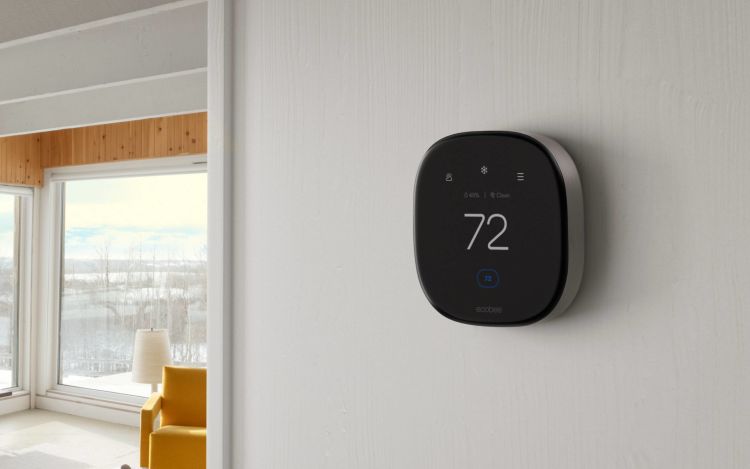ecobee Smart Thermostat Premium installed in a home against a white wall. 
