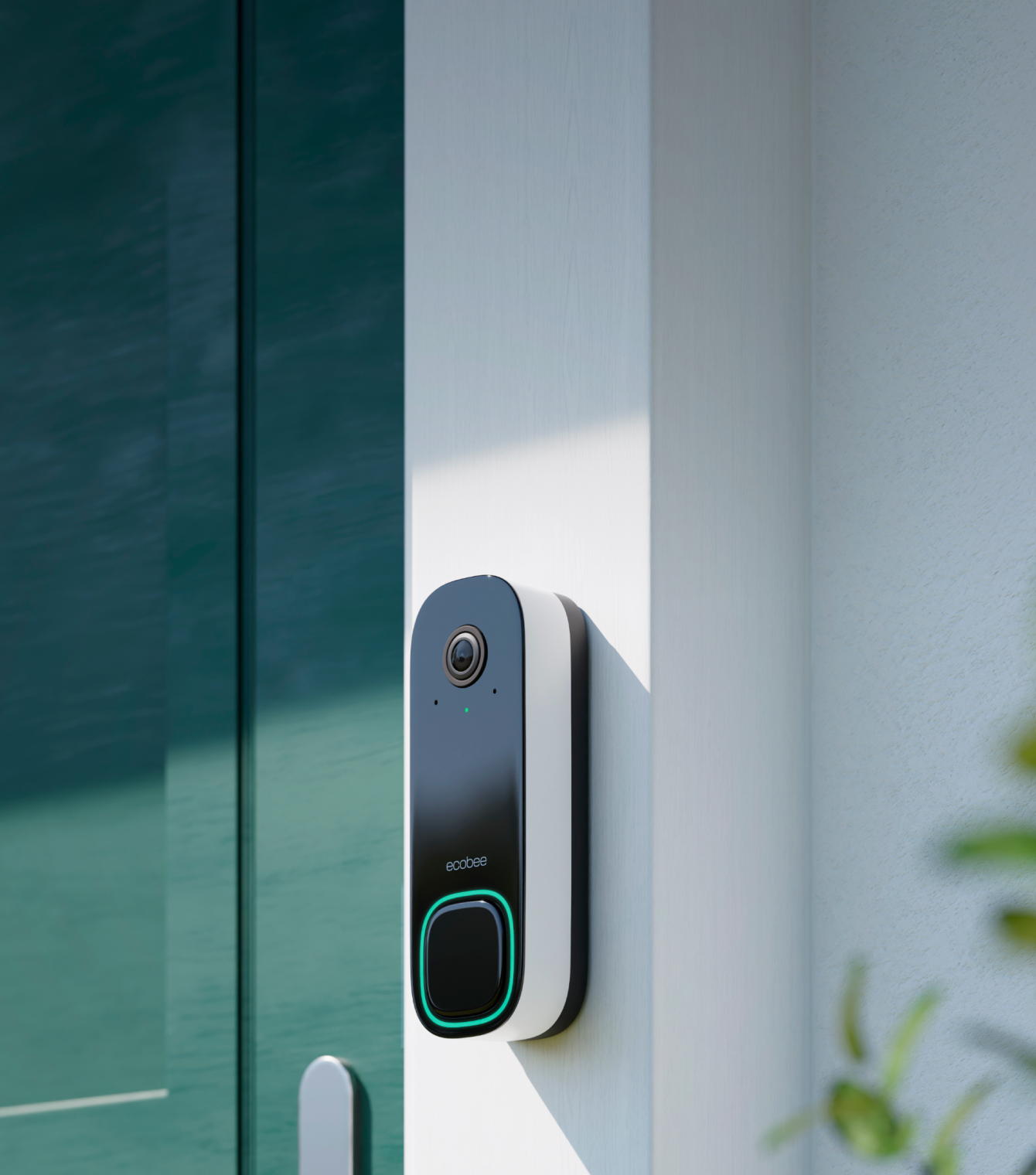 ecobee doorbell camera mounted on a doorframe beside a green door.