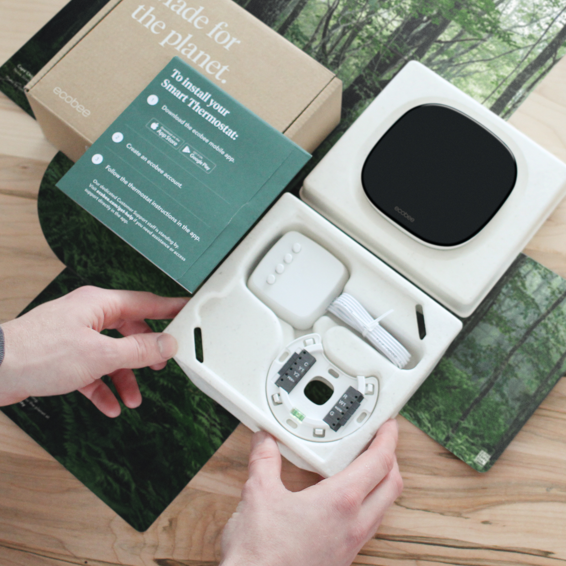 refurbished smart thermostat enhanced in its packaging