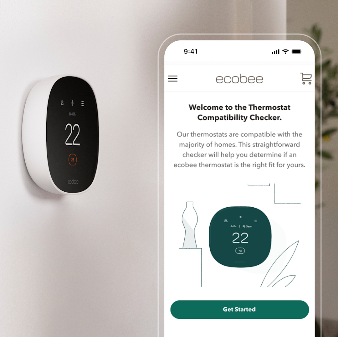 ecobee thermostat on wall with phone screen showing ecobee compatibility checker