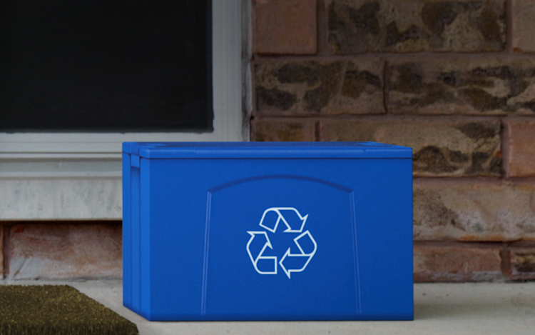 ecobee packaging disguised as a recycling bin on a front door step.