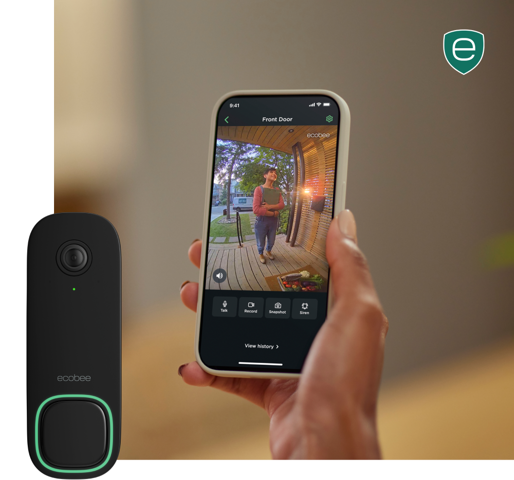 a hand holds a phone that shows the ecobee app view of someone on a front step, the ecobee smart doorbell camera is shown