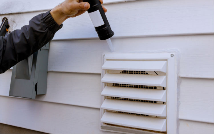 Image of someone sealing in their vent.
