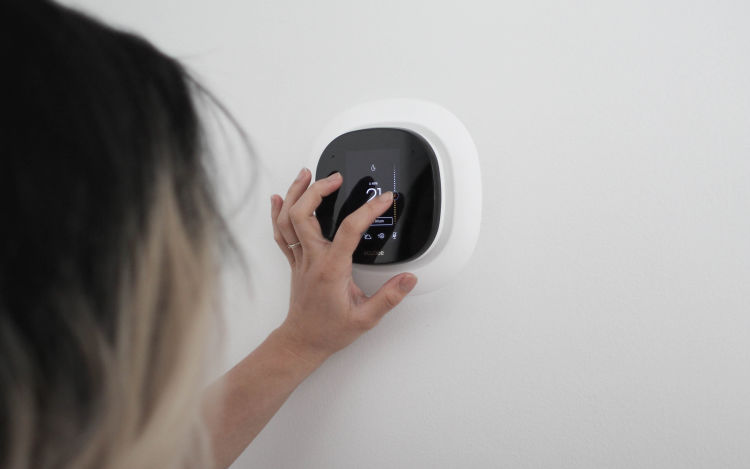 Image of someone adjusting their ecobee SmartThermostat.