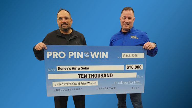 Two male members of Honey's Air and Solar team hold a large cheque for the amount of $10,000 after winning ecobee's Pro Pin For the Win Sweepstakes